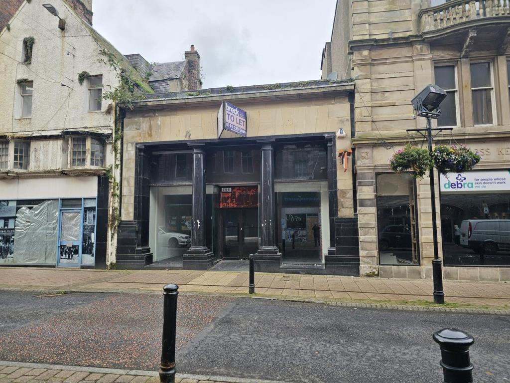Lot: 52 - VACANT DOUBLE FRONTED SHOP UNIT - Alternative view of the traditional sandstone commercial property